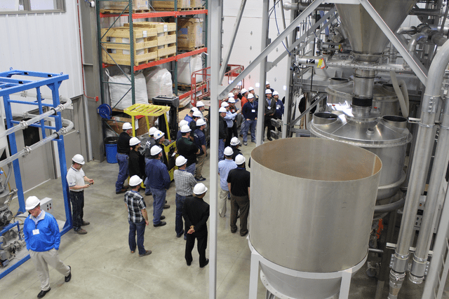 Students observe the role of pneumatic flow aids on material flow at the Kansas State University Bulk Solids Innovation Center.