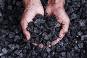 Coal and mined materials in hand